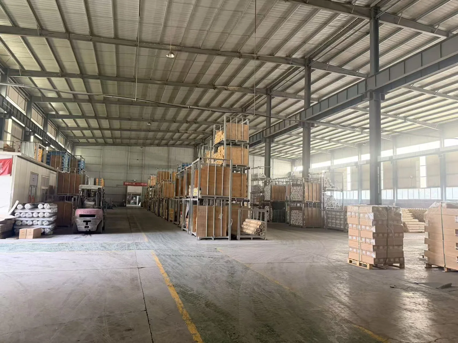 Warehouse with pallets and forklift